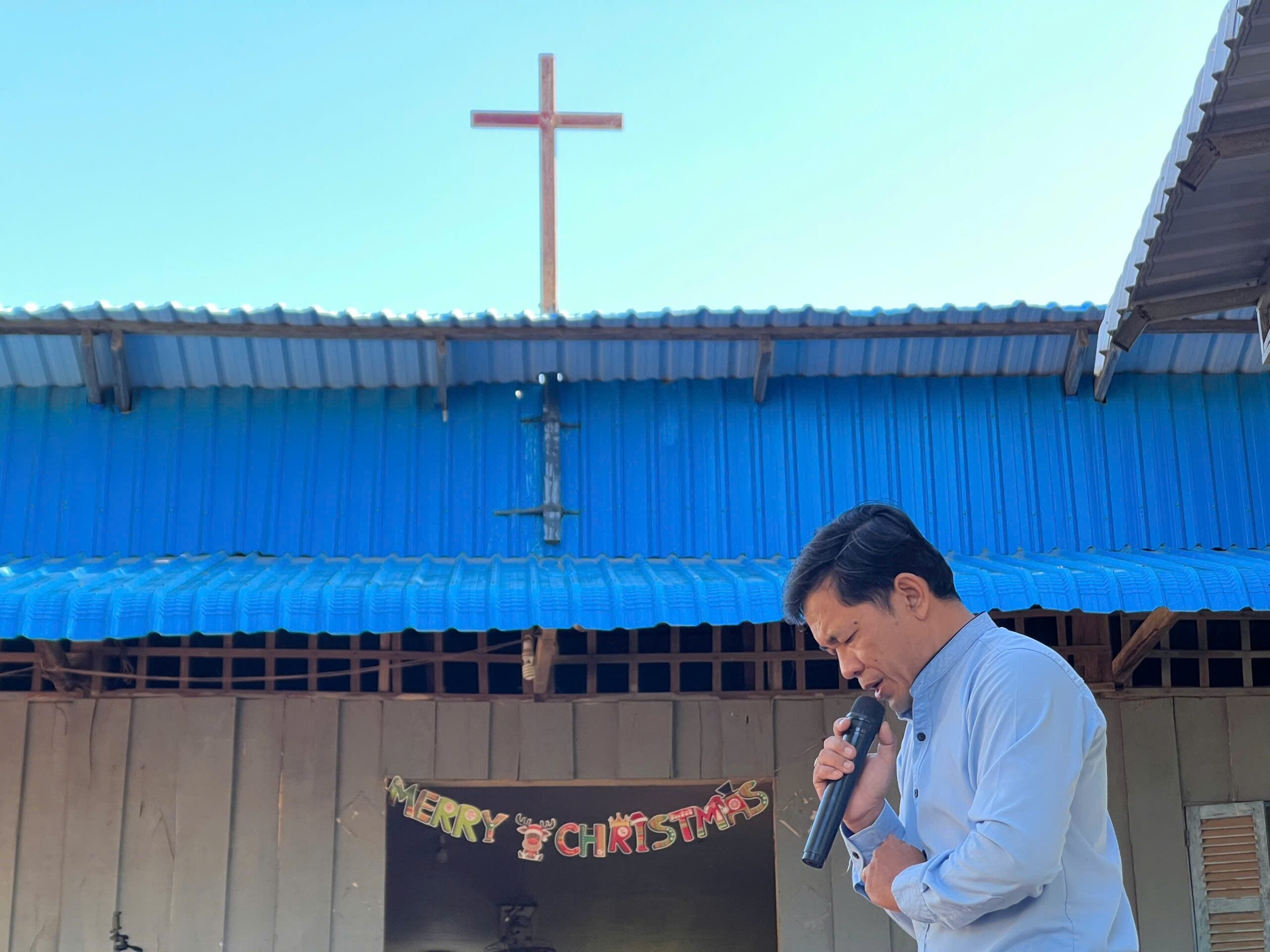 A pastor preaching at a rural church in Vietnam